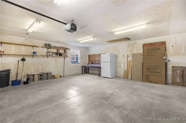 25 Redwood Ct, Sunrise Beach, MO 65079 - garage with freestanding refrigerator and a garage door opener