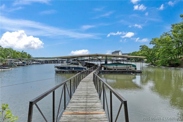 1318 Evergreen Ln Unit 4, Osage Beach, MO 65065 - dock with a water view and boat lift