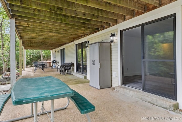 1318 Evergreen Ln Unit 4, Osage Beach, MO 65065 - view of patio / terrace featuring outdoor dining area and area for grilling