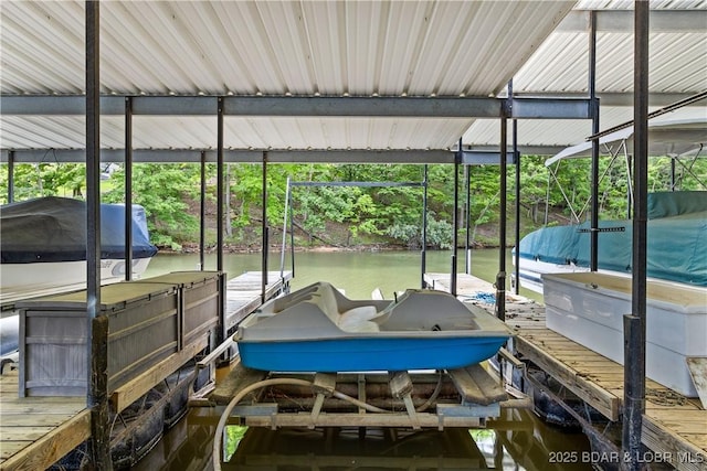 1318 Evergreen Ln Unit 4, Osage Beach, MO 65065 - dock area featuring boat lift and a water view