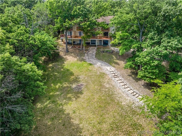 1318 Evergreen Ln Unit 4, Osage Beach, MO 65065 - view of yard featuring stairway, driveway, and a wooden deck