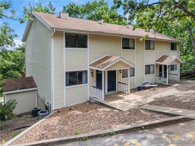 1318 Evergreen Ln Unit 4, Osage Beach, MO 65065 - view of front of house with a chimney