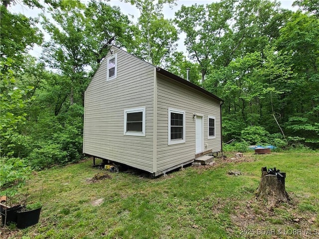 31025 Broken Circle Rd, Stover, MO 65078 - view of side of home featuring a yard and entry steps
