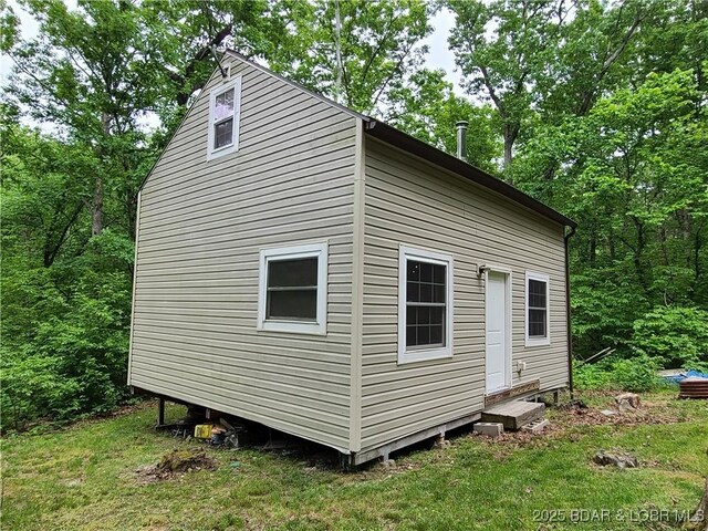 31025 Broken Circle Rd, Stover, MO 65078 - view of property exterior with entry steps and a lawn