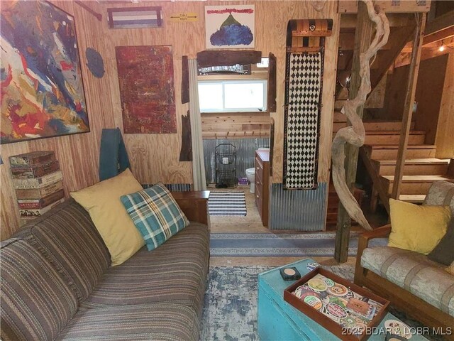 31025 Broken Circle Rd, Stover, MO 65078 - living area featuring wood walls and stairs