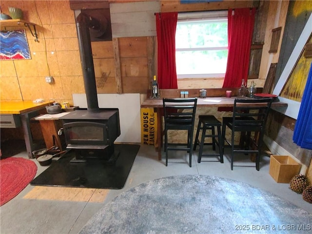 31025 Broken Circle Rd, Stover, MO 65078 - dining area featuring concrete floors and a wood stove