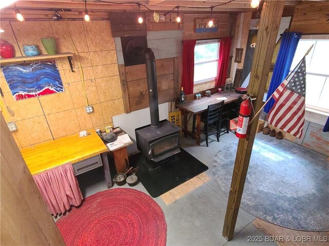 31025 Broken Circle Rd, Stover, MO 65078 - office area with a wood stove and concrete flooring