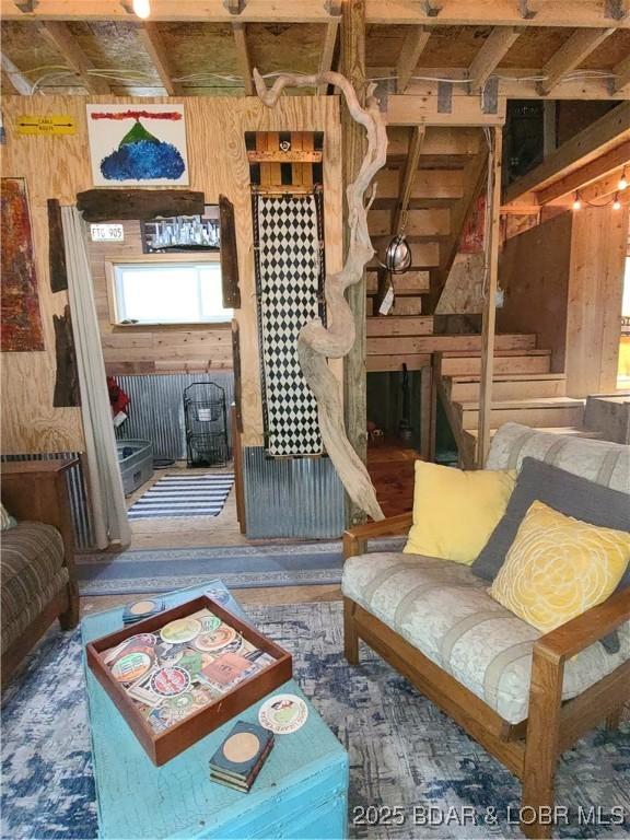 31025 Broken Circle Rd, Stover, MO 65078 - living room with wood walls and stairway