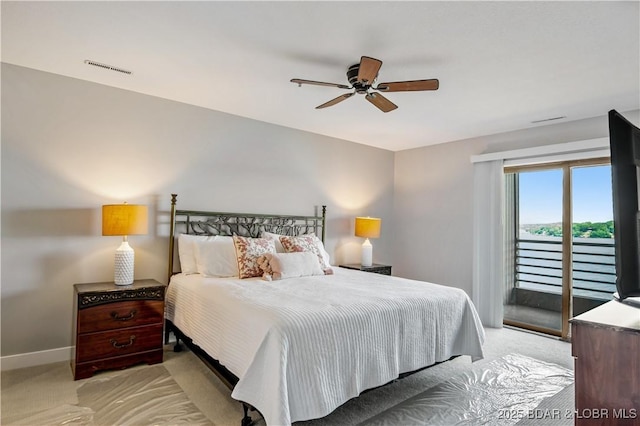 701 Cedar Rd Unit 1A, Lake Ozark, MO 65049 - bedroom with access to exterior, light carpet, baseboards, and ceiling fan