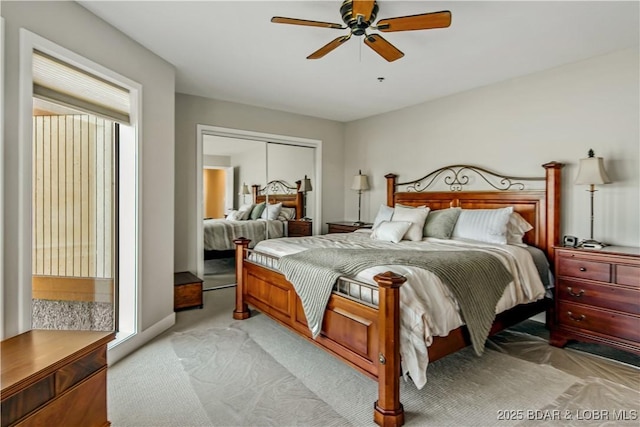 701 Cedar Rd Unit 1A, Lake Ozark, MO 65049 - bedroom featuring light carpet, multiple windows, a closet, and a ceiling fan