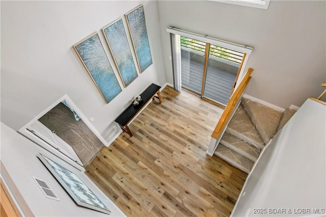 701 Cedar Rd Unit 1A, Lake Ozark, MO 65049 - stairs featuring wood finished floors and baseboards