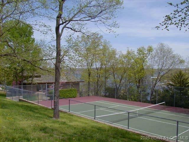 701 Cedar Rd Unit 1A, Lake Ozark, MO 65049 - view of tennis court featuring community basketball court