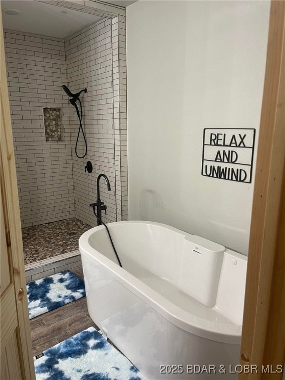 1760 Deans Creek Rd, Richland, MO 65556 - full bathroom with wood finished floors, a soaking tub, and a tile shower