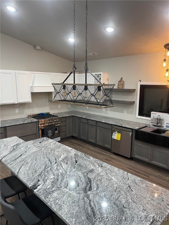 1760 Deans Creek Rd, Richland, MO 65556 - kitchen featuring appliances with stainless steel finishes, dark wood-style flooring, light stone counters, recessed lighting, and lofted ceiling