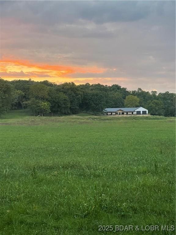 1760 Deans Creek Rd, Richland, MO 65556 - yard at dusk featuring a rural view
