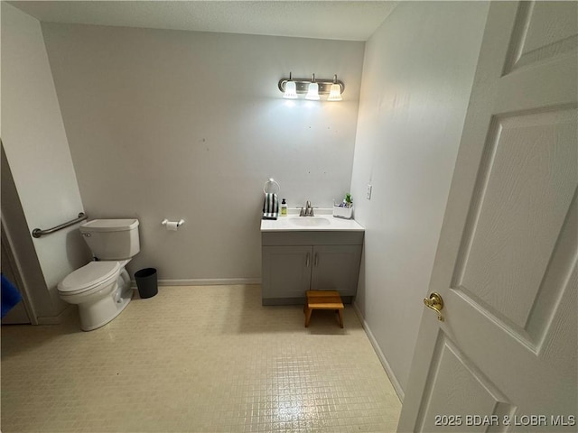 18400 Alum Springs Rd, Versailles, MO 65084 - bathroom with vanity, toilet, and baseboards