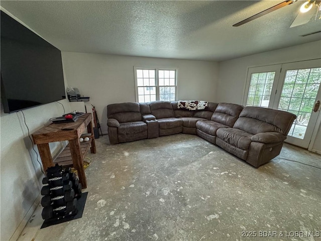 18400 Alum Springs Rd, Versailles, MO 65084 - living area with ceiling fan, a textured ceiling, and baseboards