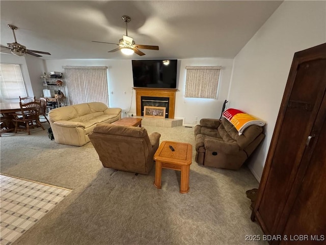 18400 Alum Springs Rd, Versailles, MO 65084 - living room with ceiling fan, carpet, and a tile fireplace