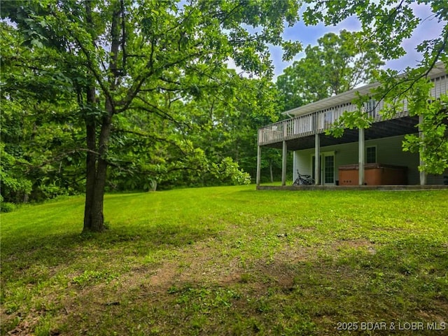 18400 Alum Springs Rd, Versailles, MO 65084 - view of grassy yard with a hot tub and a wooden deck
