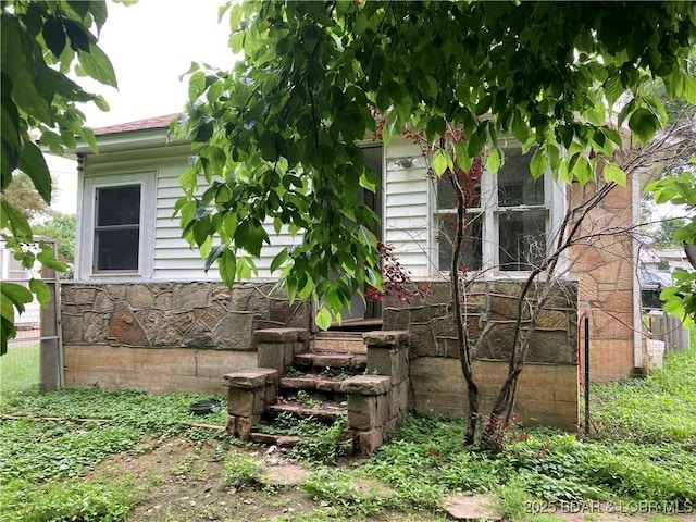 203 S Hunter St, Versailles, MO 65084 - view of side of home featuring stone siding