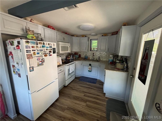 406 Staley Hollow Dr, Sunrise Beach, MO 65079 - kitchen with white appliances, a sink, decorative backsplash, and dark wood-type flooring