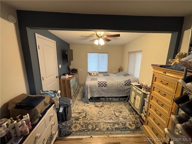 406 Staley Hollow Dr, Sunrise Beach, MO 65079 - bedroom with wood finished floors and a ceiling fan