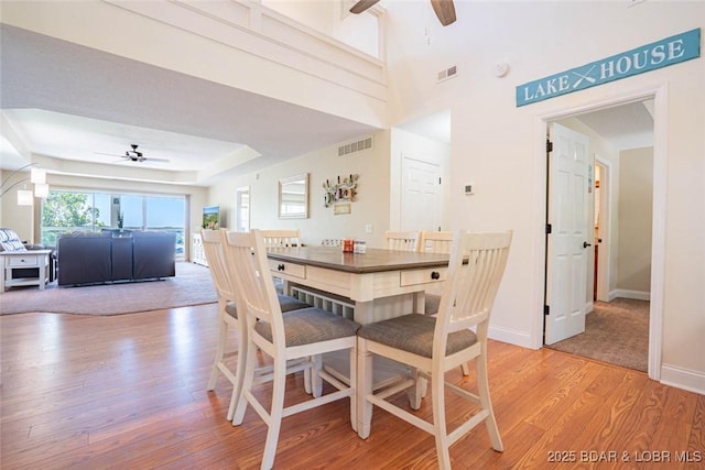 4066 Horseshoe Bend Pkwy Unit 3A, Lake Ozark, MO 65049 - dining space with a ceiling fan, light wood-style floors, and baseboards