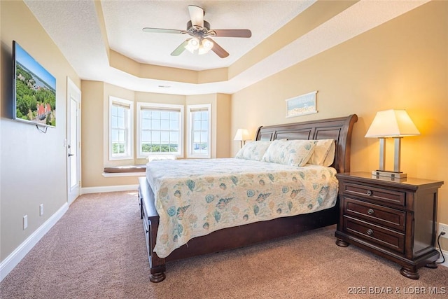 4066 Horseshoe Bend Pkwy Unit 3A, Lake Ozark, MO 65049 - carpeted bedroom featuring baseboards, a tray ceiling, and a ceiling fan