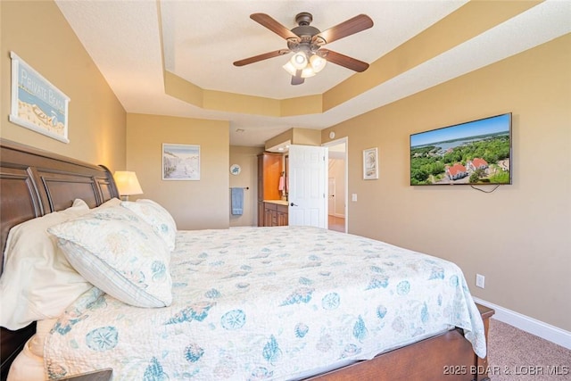 4066 Horseshoe Bend Pkwy Unit 3A, Lake Ozark, MO 65049 - bedroom with carpet floors, baseboards, a tray ceiling, and a ceiling fan
