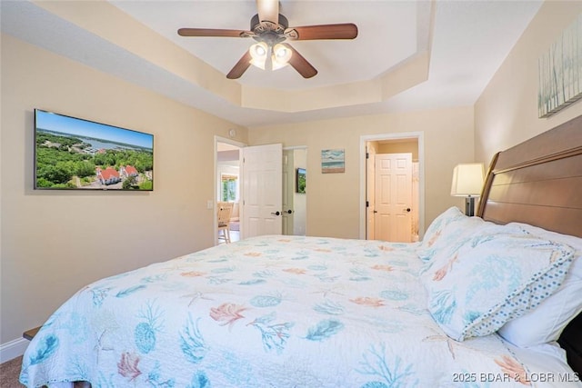 4066 Horseshoe Bend Pkwy Unit 3A, Lake Ozark, MO 65049 - bedroom featuring a tray ceiling and ceiling fan