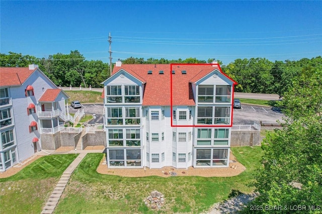 4066 Horseshoe Bend Pkwy Unit 3A, Lake Ozark, MO 65049 - rear view of property with a yard