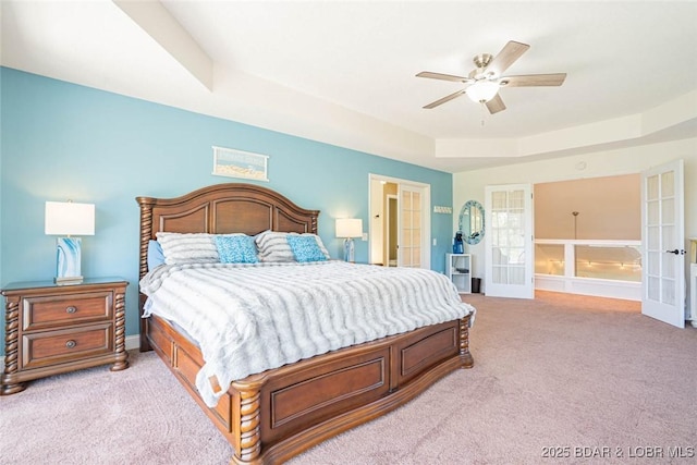 4066 Horseshoe Bend Pkwy Unit 3A, Lake Ozark, MO 65049 - bedroom with light colored carpet, a raised ceiling, french doors, and a ceiling fan