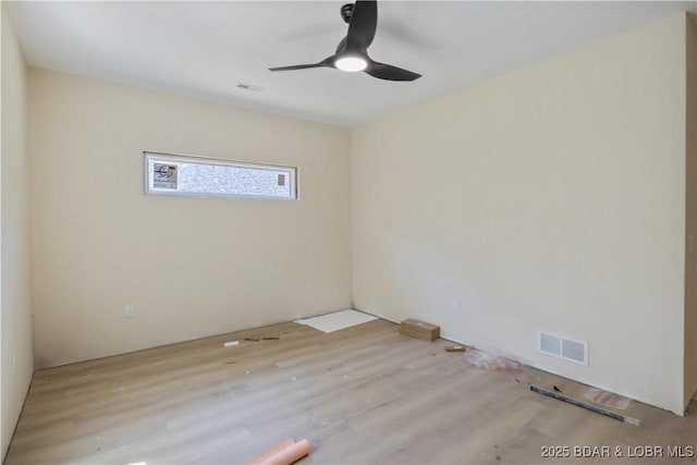 535 Grand Point Blvd, Sunrise Beach, MO 65079 - unfurnished room with wood finished floors and a ceiling fan