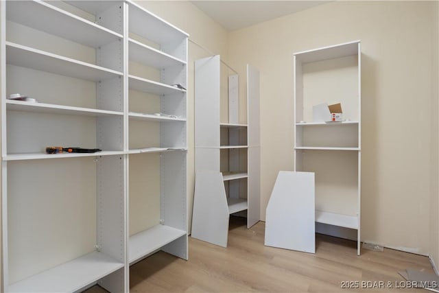 535 Grand Point Blvd, Sunrise Beach, MO 65079 - spacious closet featuring wood finished floors