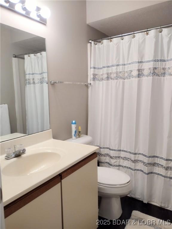 2500 Bay Point Ln Unit 342, Osage Beach, MO 65020 - bathroom featuring vanity and a shower with curtain