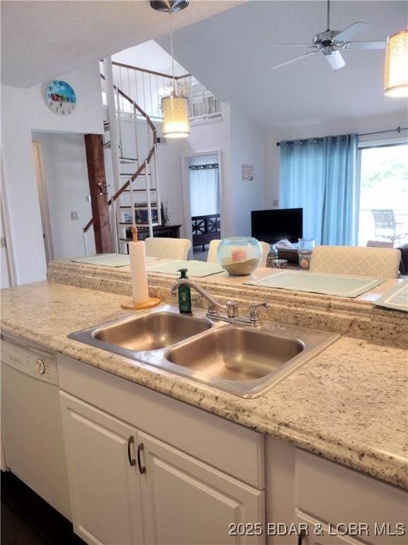 2500 Bay Point Ln Unit 342, Osage Beach, MO 65020 - kitchen with white dishwasher, white cabinetry, a ceiling fan, light countertops, and pendant lighting