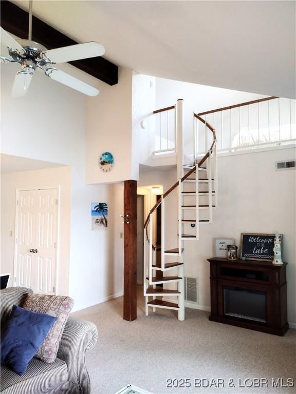 2500 Bay Point Ln Unit 342, Osage Beach, MO 65020 - carpeted living area featuring high vaulted ceiling, a ceiling fan, and stairway