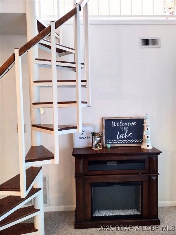 2500 Bay Point Ln Unit 342, Osage Beach, MO 65020 - stairway featuring baseboards and carpet floors