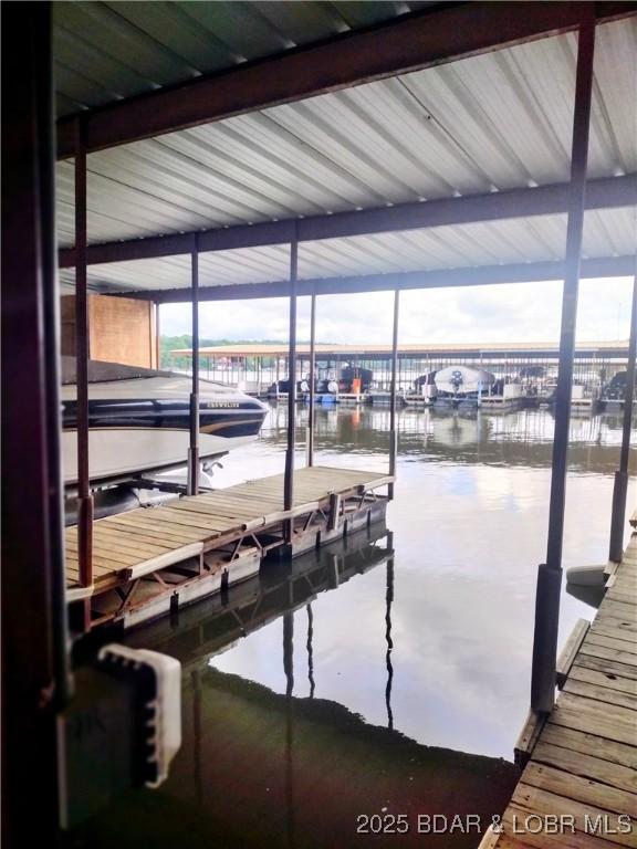 2500 Bay Point Ln Unit 342, Osage Beach, MO 65020 - dock featuring a water view and boat lift