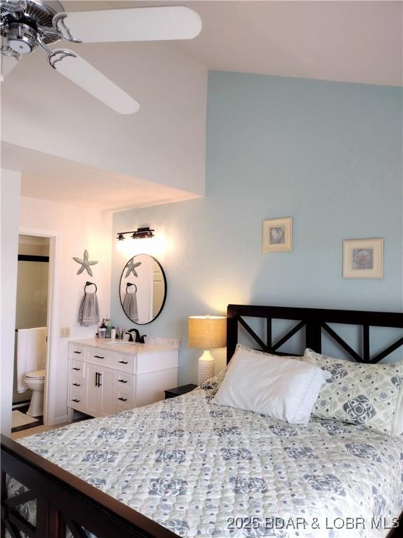 2500 Bay Point Ln Unit 342, Osage Beach, MO 65020 - bedroom with ensuite bath and high vaulted ceiling