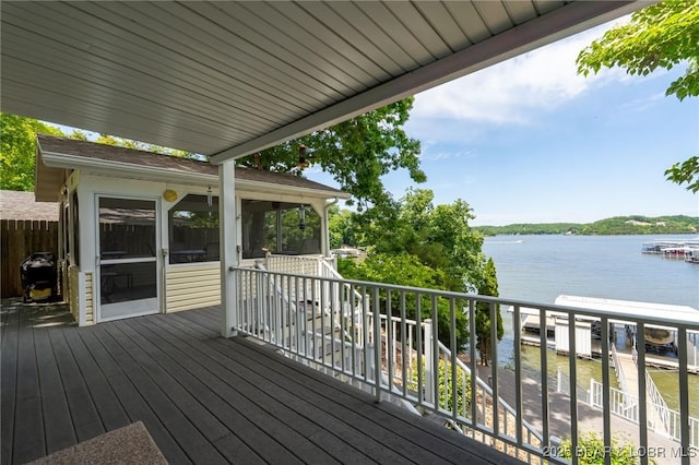 55 Nonsuch Ct, Lake Ozark, MO 65049 - wooden deck featuring a water view and a sunroom