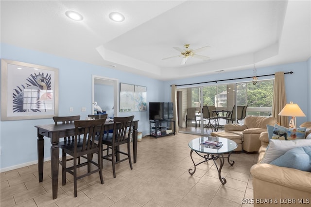 289 Charleston Dr Unit 2B, Lake Ozark, MO 65049 - dining area featuring a raised ceiling, ceiling fan, recessed lighting, and baseboards