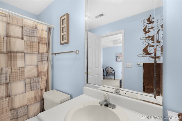 289 Charleston Dr Unit 2B, Lake Ozark, MO 65049 - bathroom with toilet and vanity
