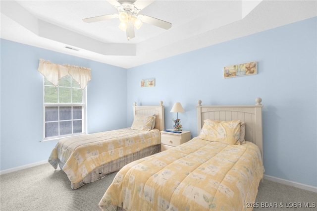 289 Charleston Dr Unit 2B, Lake Ozark, MO 65049 - bedroom with a raised ceiling, carpet flooring, baseboards, and a ceiling fan