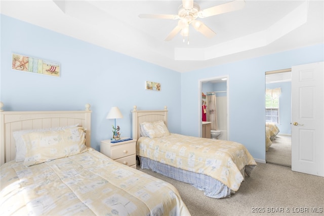 289 Charleston Dr Unit 2B, Lake Ozark, MO 65049 - carpeted bedroom featuring a tray ceiling and a ceiling fan