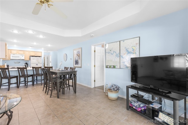 289 Charleston Dr Unit 2B, Lake Ozark, MO 65049 - dining space with recessed lighting, a ceiling fan, a raised ceiling, baseboards, and light tile patterned floors