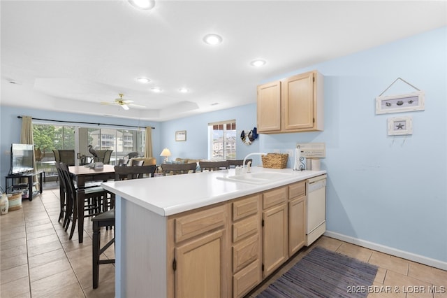289 Charleston Dr Unit 2B, Lake Ozark, MO 65049 - kitchen featuring light brown cabinets, dishwasher, a peninsula, a ceiling fan, and a sink