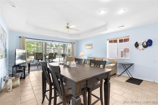 289 Charleston Dr Unit 2B, Lake Ozark, MO 65049 - dining area featuring a tray ceiling, a ceiling fan, light tile patterned floors, recessed lighting, and baseboards