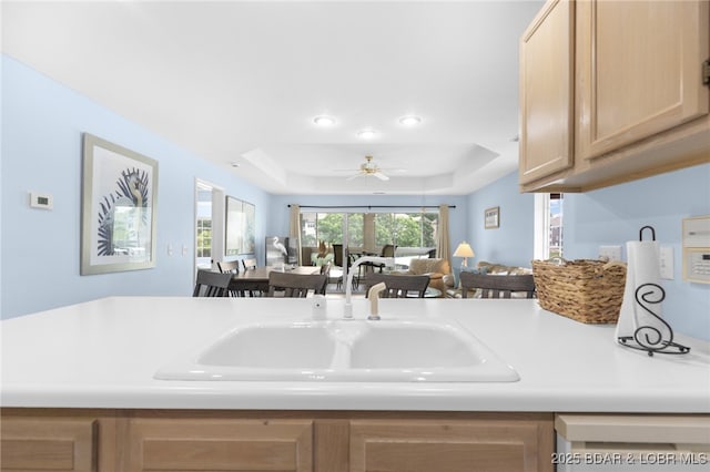 289 Charleston Dr Unit 2B, Lake Ozark, MO 65049 - kitchen with light brown cabinets, a raised ceiling, light countertops, open floor plan, and recessed lighting