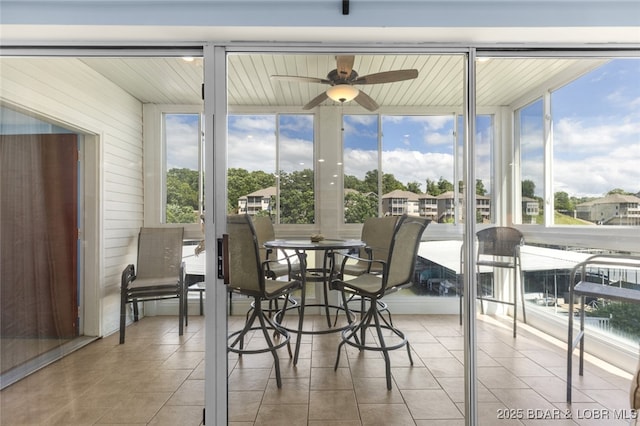 289 Charleston Dr Unit 2B, Lake Ozark, MO 65049 - sunroom featuring ceiling fan, tile patterned floors, and expansive windows
